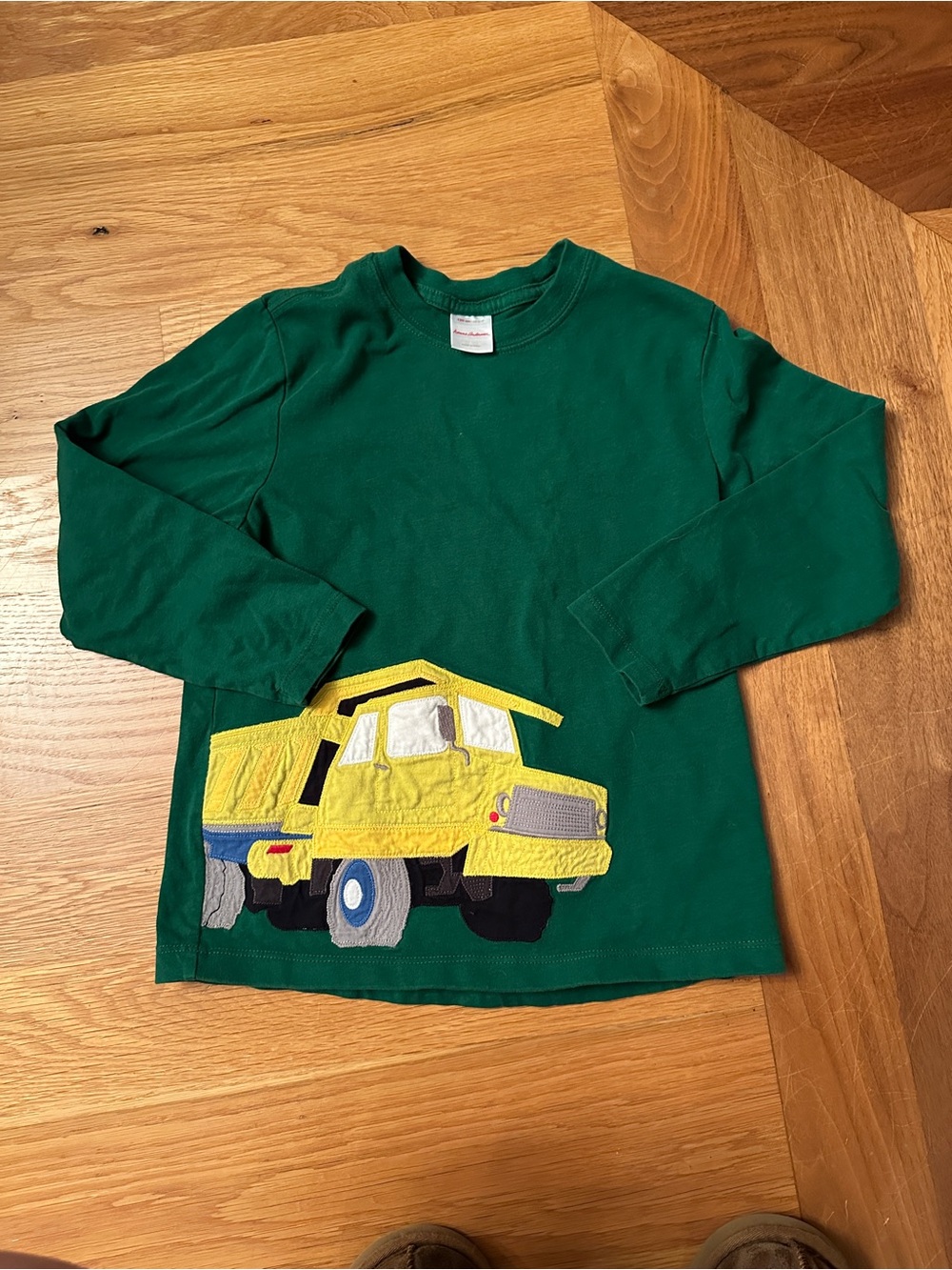 Hanna Andersson long sleeve tee with large yellow dump truck appliqué.